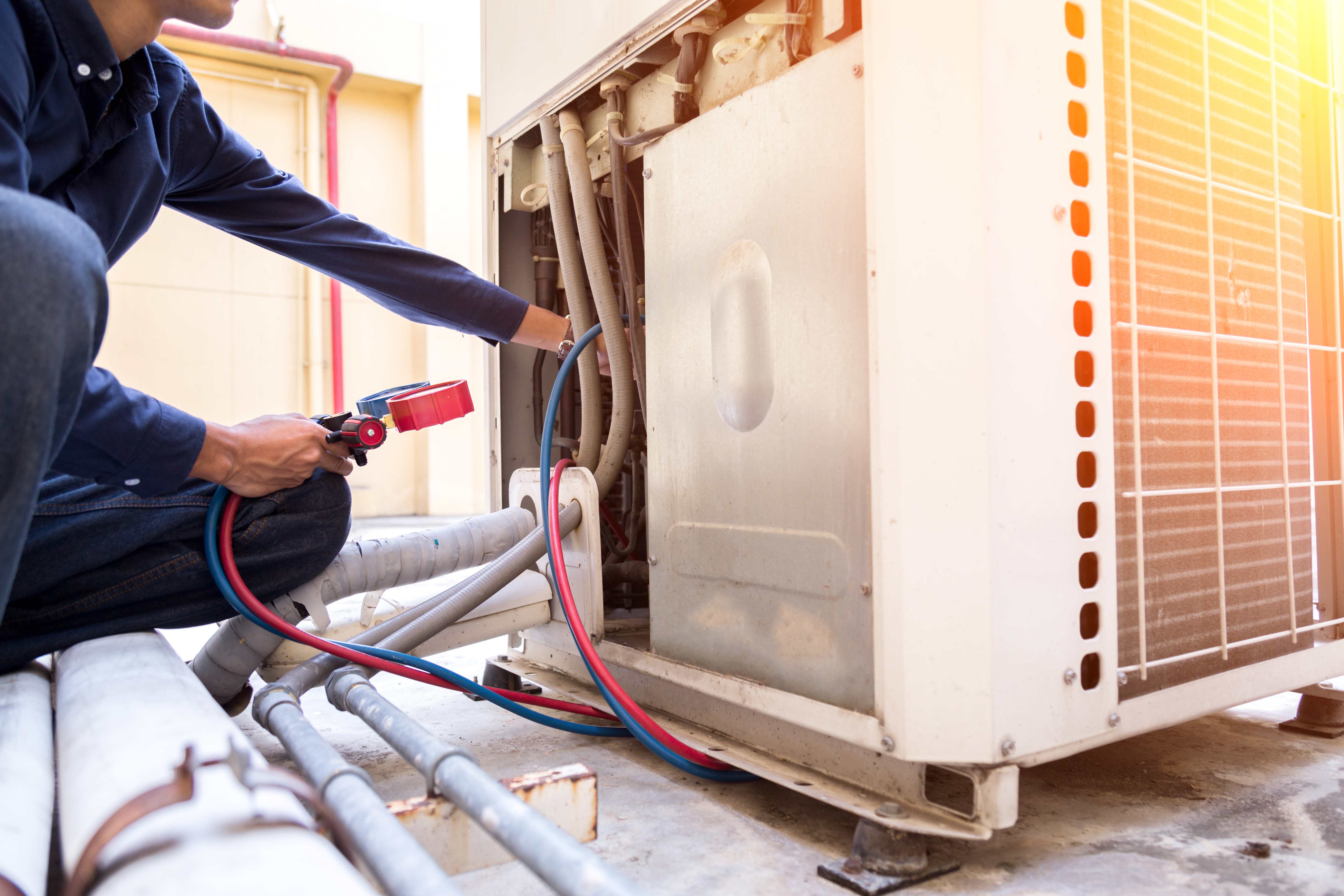 Technician checking AC unit